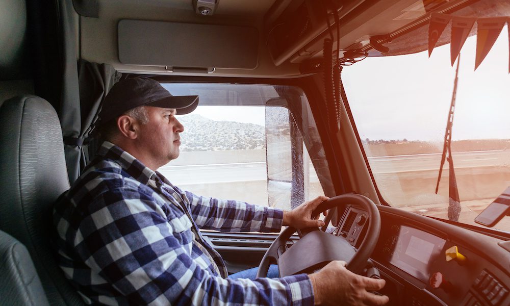 Top 3 Tips for Understanding What Insurance You Need as a Trucker - Man Driving A Truck